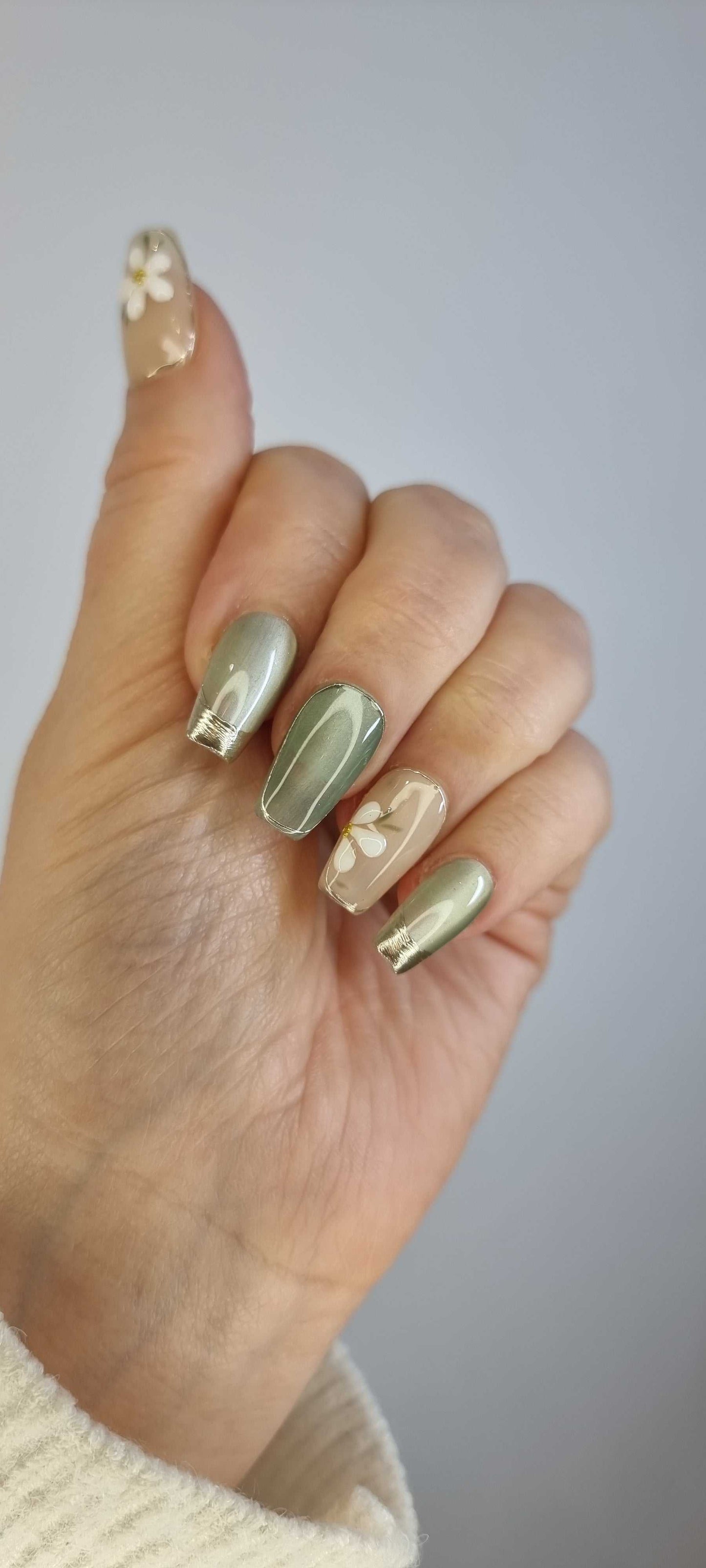 Hand wearing Tala short square press-on nails, applied professionally by Nail Addict.