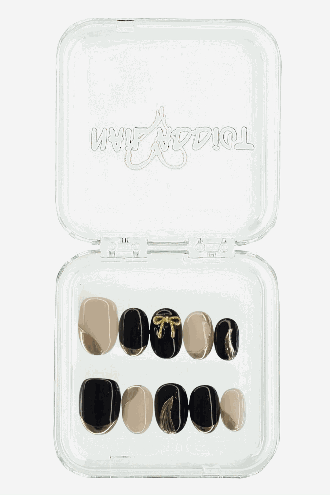 Muscat Mystique black and nude almond press-on nails with gold bow design, displayed in clear Nail Addict case
