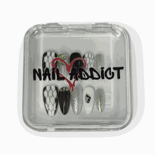The branded Nail Addict packaging for the Ajman Aesthetic press-on nail set.