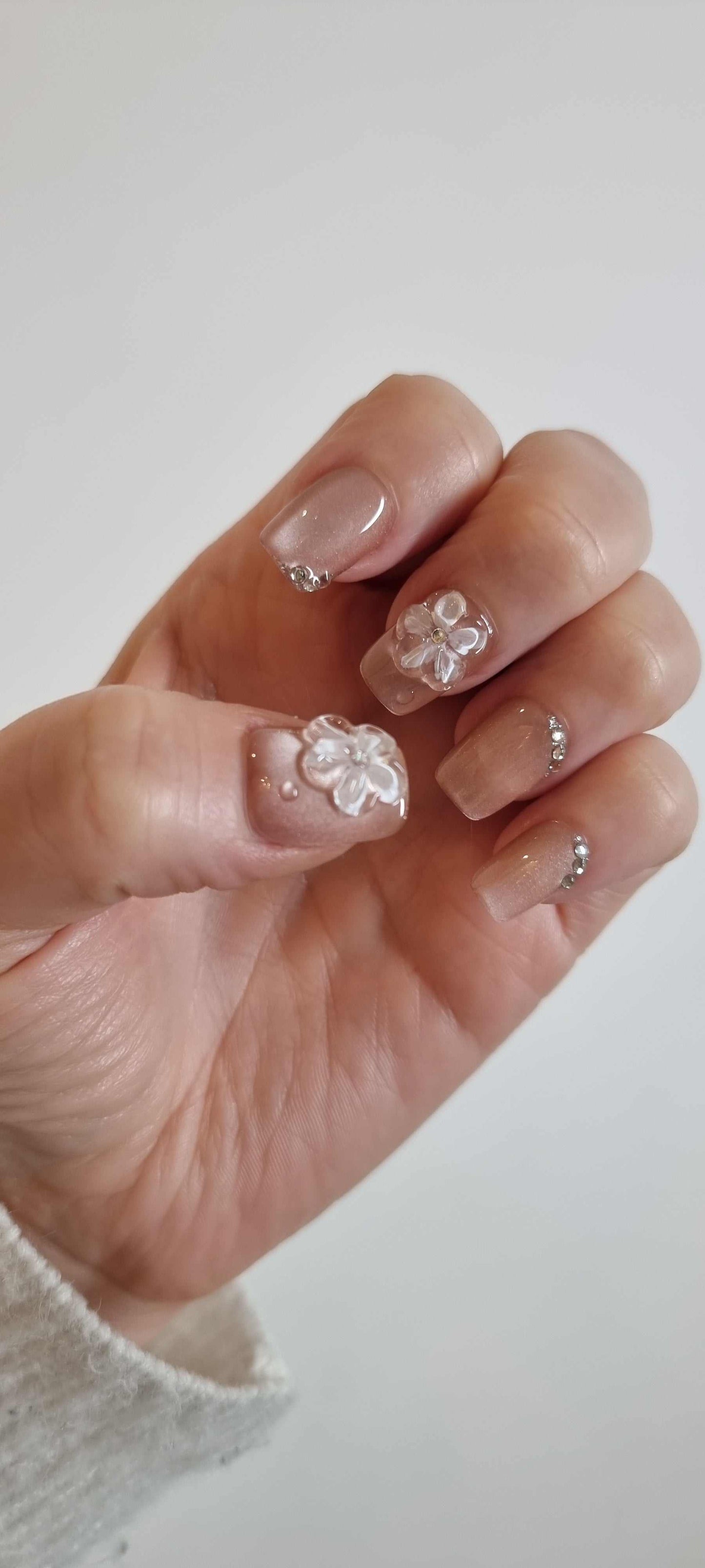 Set of Shaima false press-on nails in a glossy, light brown color.