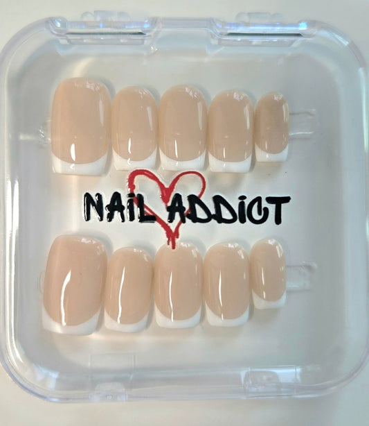 The Flora French manicure press-on nail set presented in its clear, reusable Nail Addict branded case.