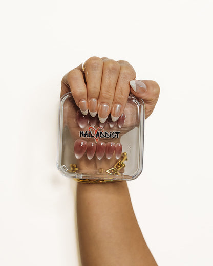 French glazed press on nails worn on hand – Glazed Almond Nailaddict reusable press on nails UAE
