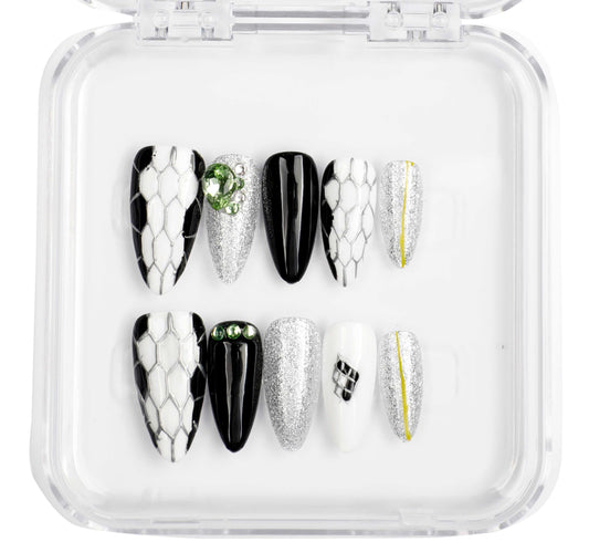 Ajman Aesthetic press-on nail set, long almond shape, nude and gold design.