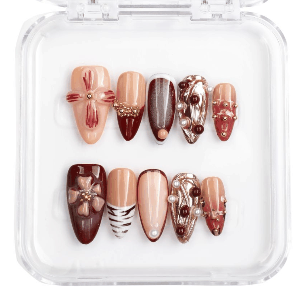 Arabian Nights press-on nail set, long almond shape, dark shimmering color.