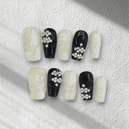 Full set of Dalia nude and brown long coffin press-on nails, displayed in the box.