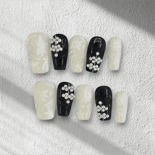 Full set of Dalia nude and brown long coffin press-on nails, displayed in the box.