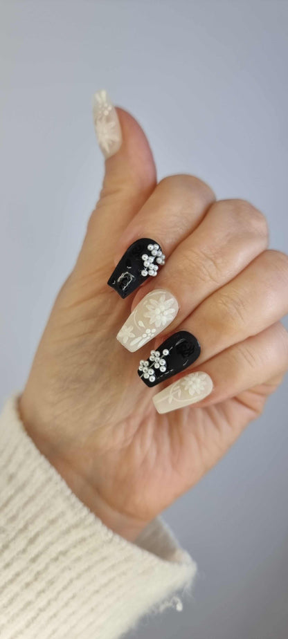 Hand wearing the Dalia nude press-on nails, applied by Nail Addict.