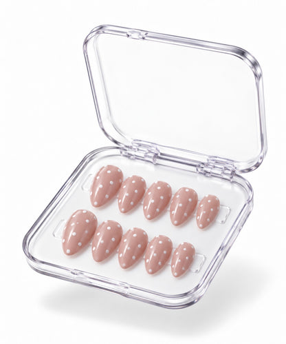 Dolce Dot nude-pink almond polka-dot press-on nails in clear case on white background