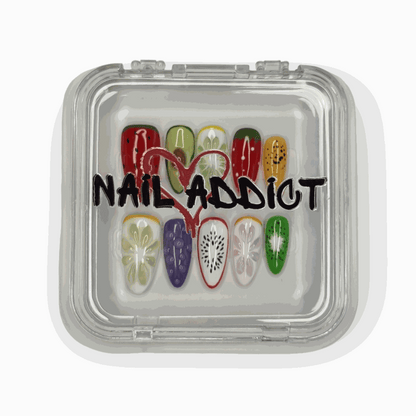 The complete Fujariah Fruity Flair press-on nail set, displayed in its clear, branded Nail Addict case.