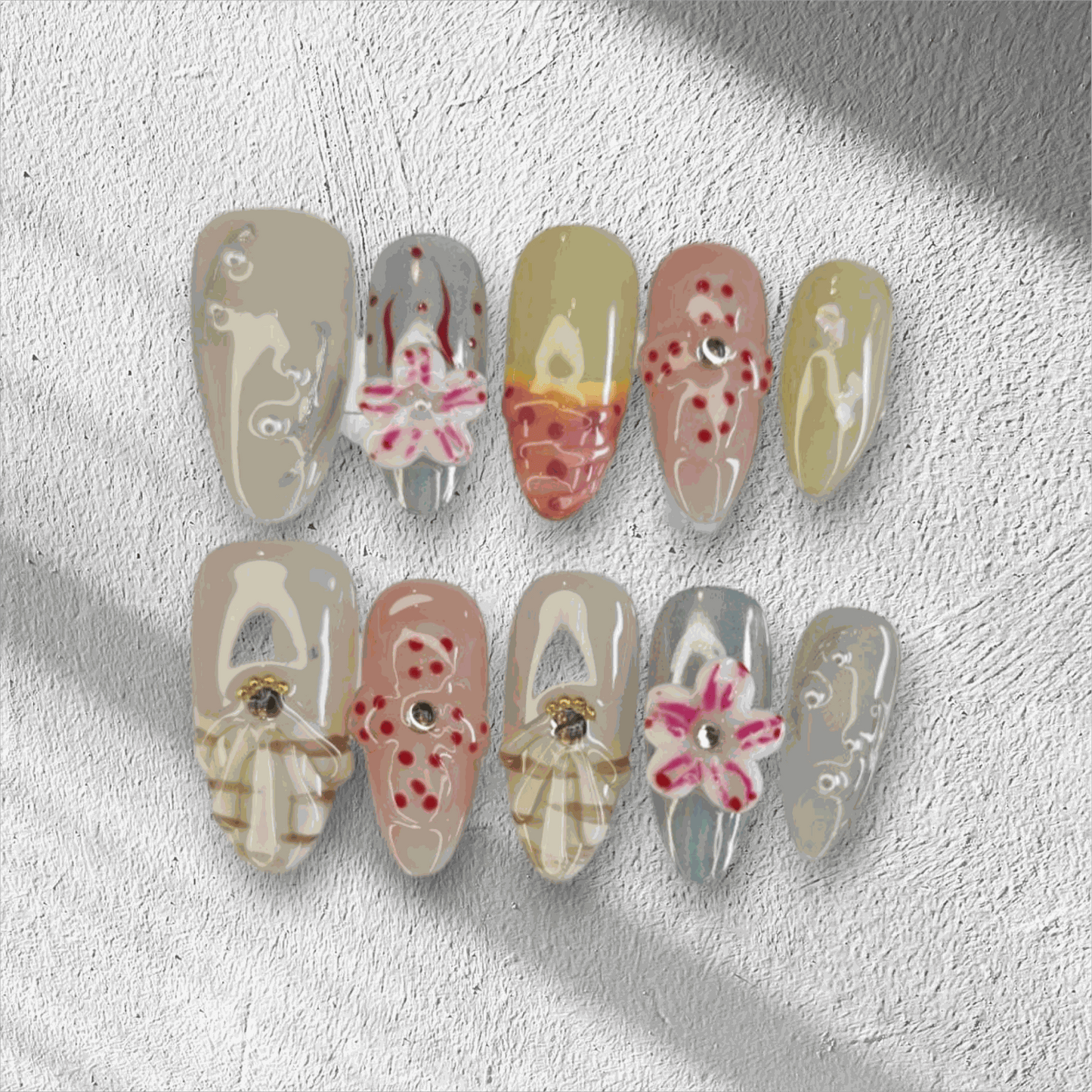 Madinah Majesty black, pink, and chrome coffin press-on nails by Nail Addict, with heart and butterfly gems