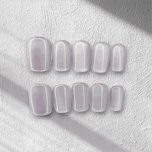 Manama Majesty pearlescent light purple short oval press-on nails by Nail Addict, with a glossy finish