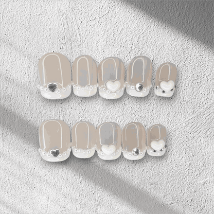  Nada pink French tip long coffin press-on nails by Nail Addict, with a white and gold glitter accent nail.