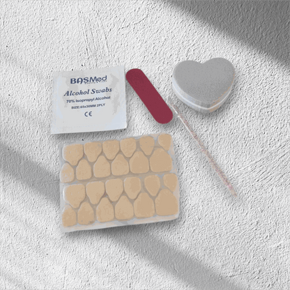 The contents of the Nail Addict press-on nail application kit, including glue and tools.