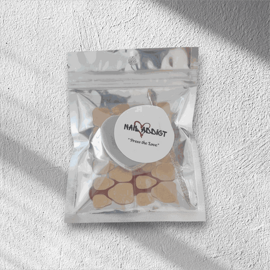 The complete Nail Addict press-on nail application kit packaged in its silver, resealable travel-friendly pouch.