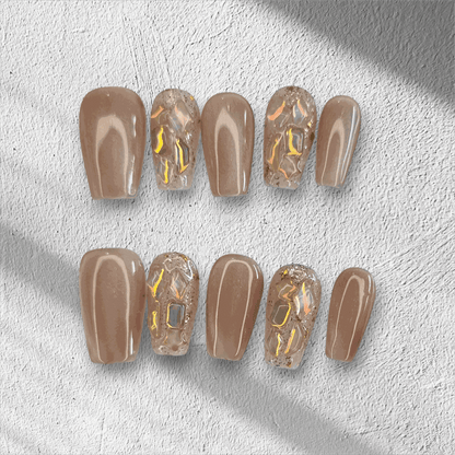 Full set of Najma almond-shaped press-on nails in two distinct colors displayed in the box.
