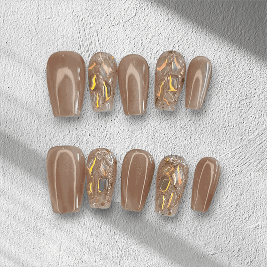 Full set of Najma almond-shaped press-on nails in two distinct colors displayed in the box.