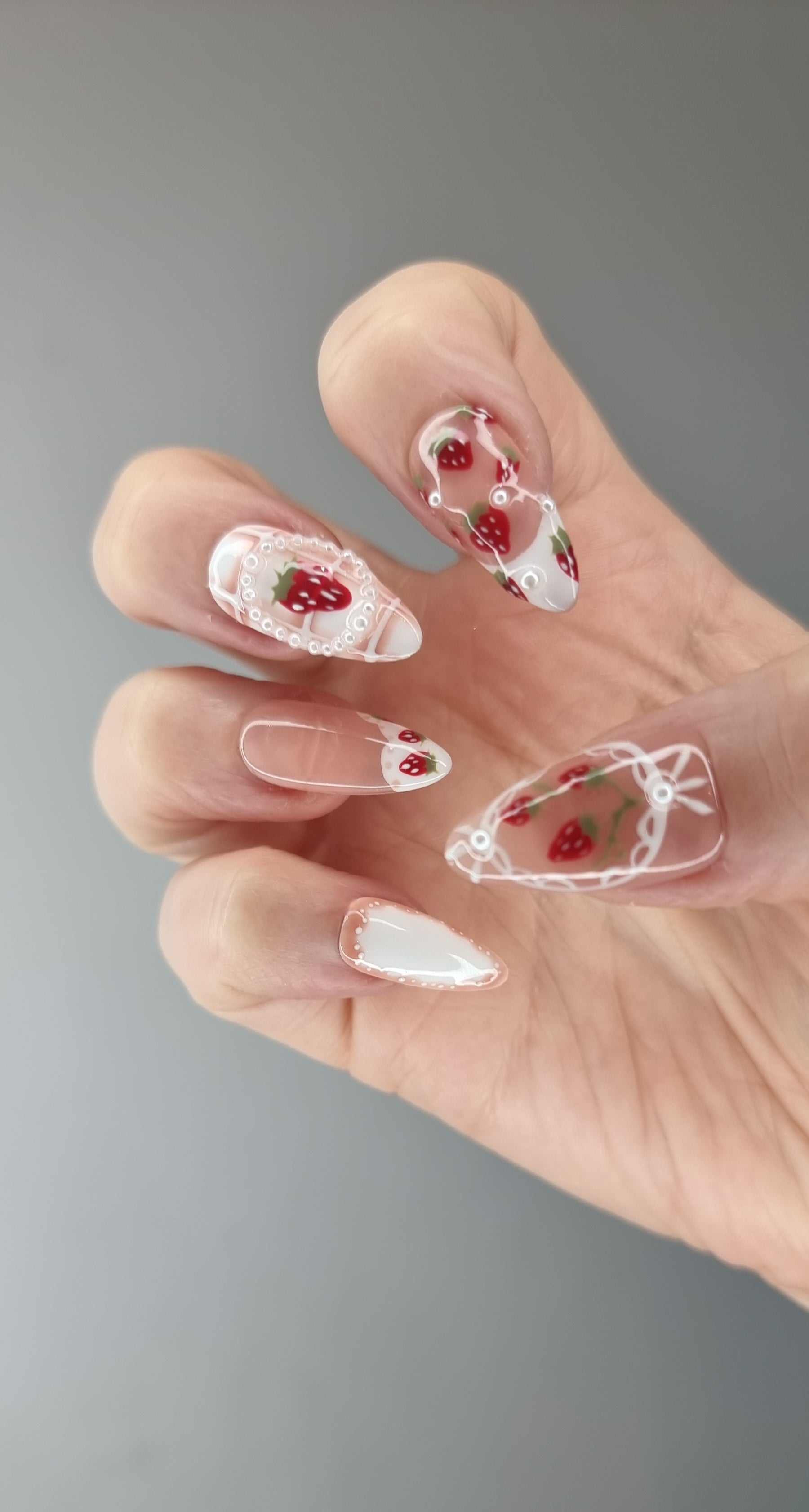 Omani Oasis press-on nails in a long almond shape, showcasing the elegant design.