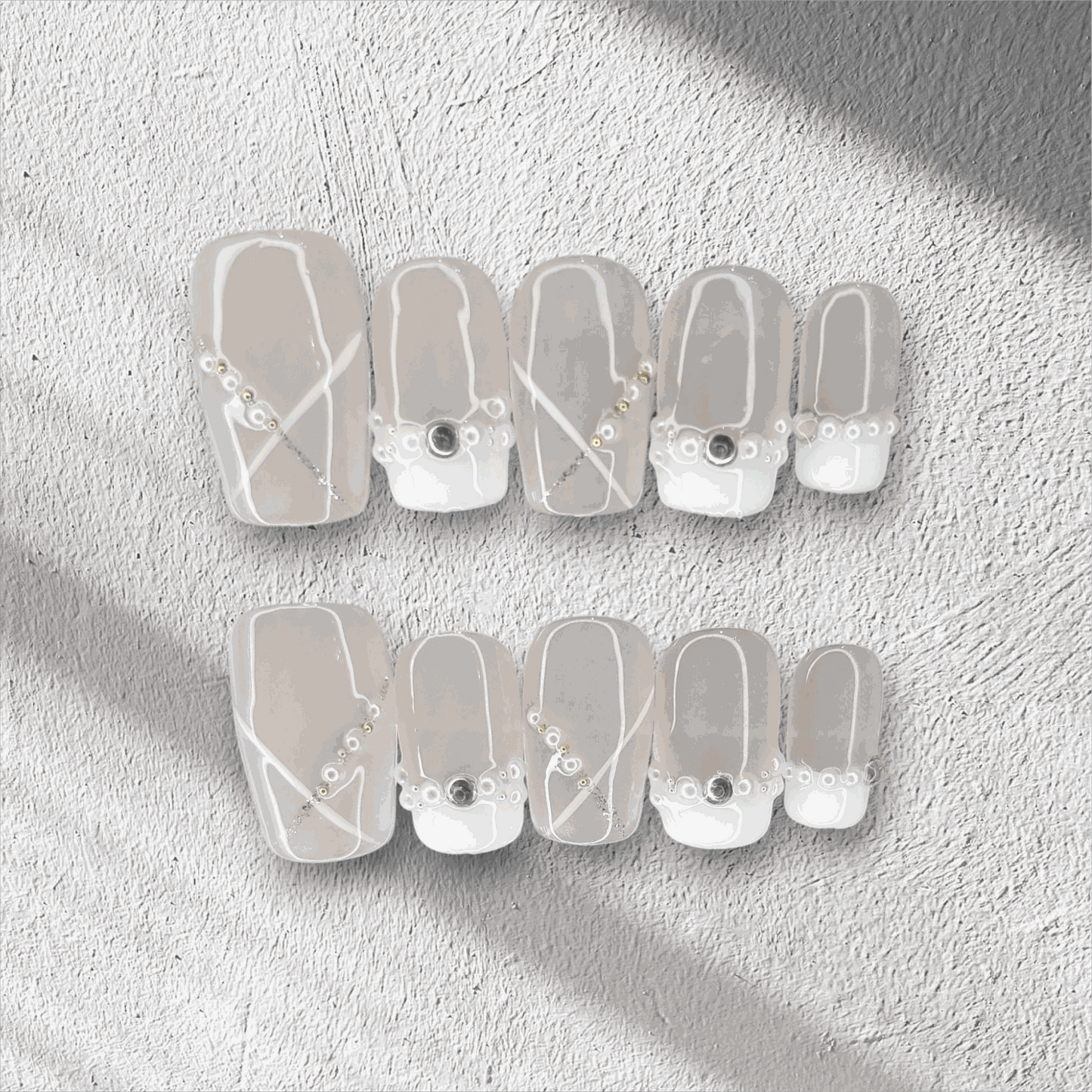 Full set of Pearl of Qatar press-on nails in a square shape, displayed in the box.