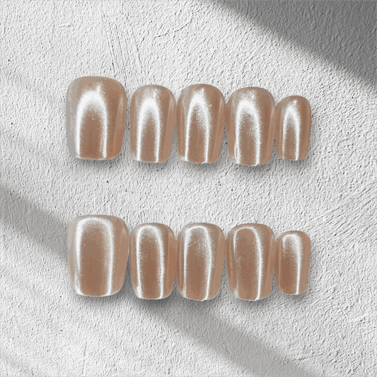 Full set of Pearls of Bahrain press-on nails in a short square shape, displayed in packaging.