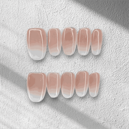 The Raneem press-on nail set in a short almond shape with an ombre design.