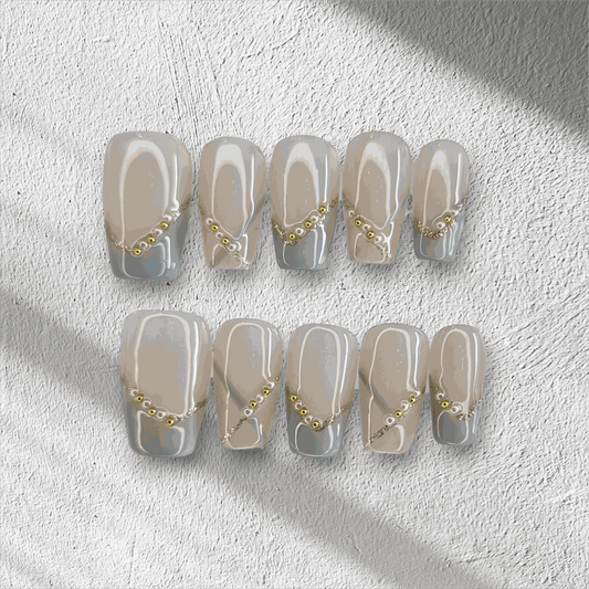 Full set of Ranya translucent press-on nails with a sparkle design, displayed in the box.