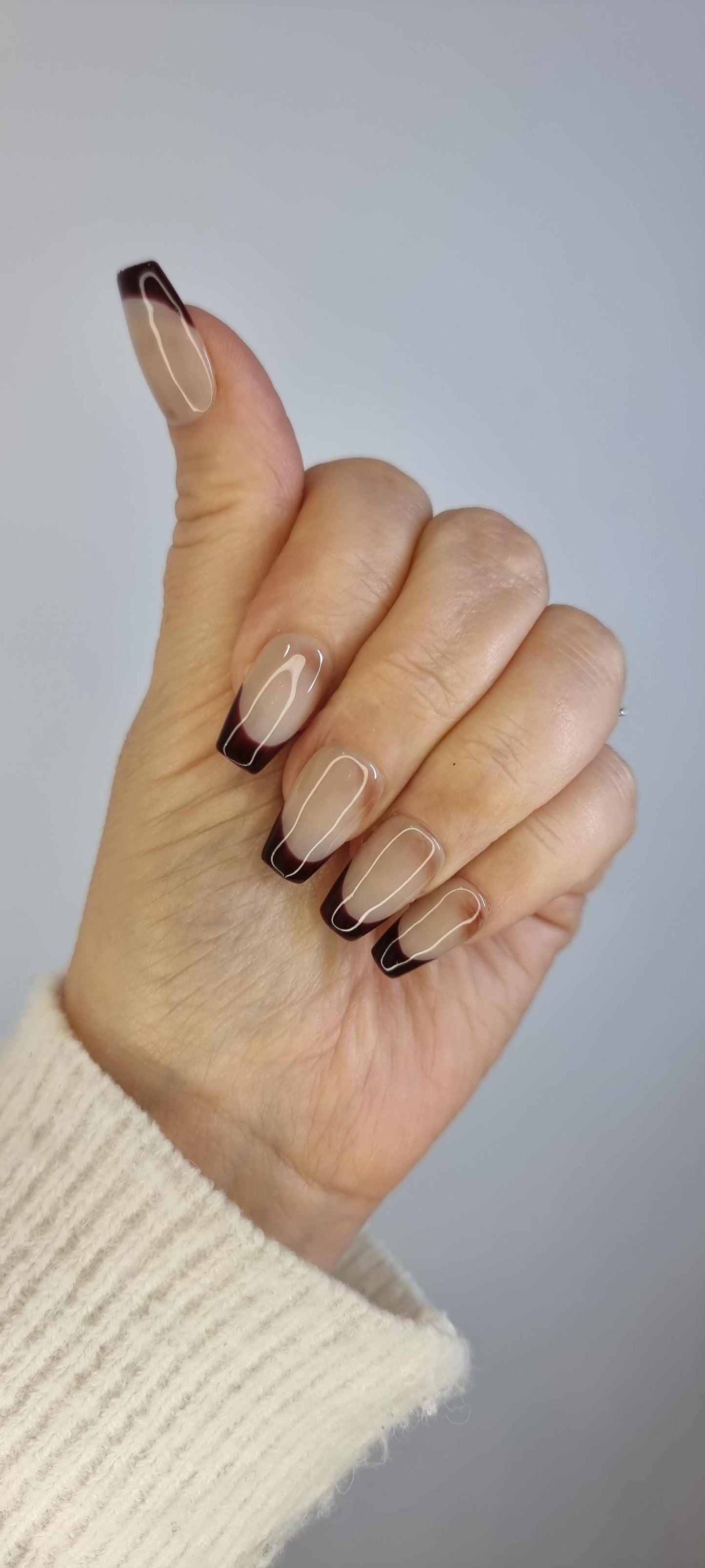 Close-up of the Riham press-on manicure, highlighting the modern design.