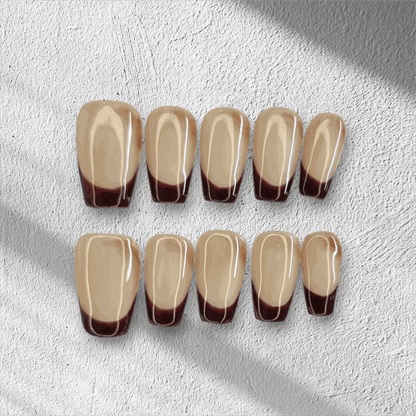 The Riham press-on nail set in a long coffin shape, displayed in the box.