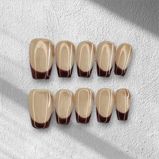 The Riham press-on nail set in a long coffin shape, displayed in the box.