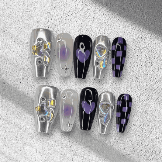 Full set of Riyadh Radiance silver, glossy, and black press-on nails displayed in the box.