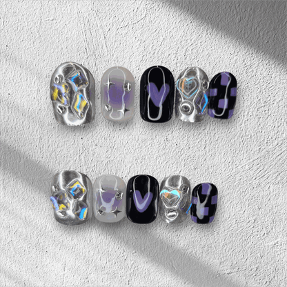 Set of silver, glossy, and black Riyadh Radiance press-on nails, an elegant contrasting design.