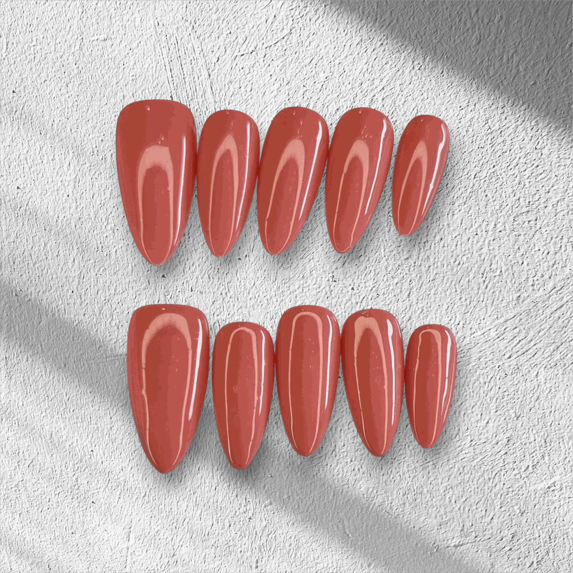 Full set of Rose press-on nails featuring a pink floral design, displayed in the box.