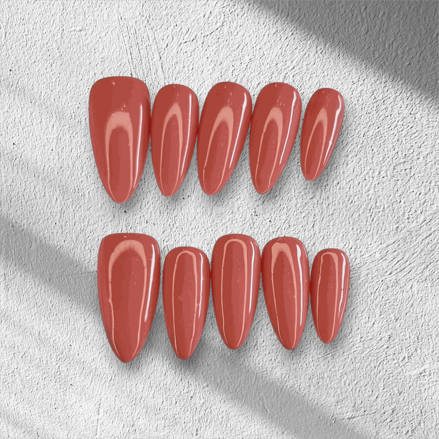 Full set of Rose press-on nails featuring a pink floral design, displayed in the box.