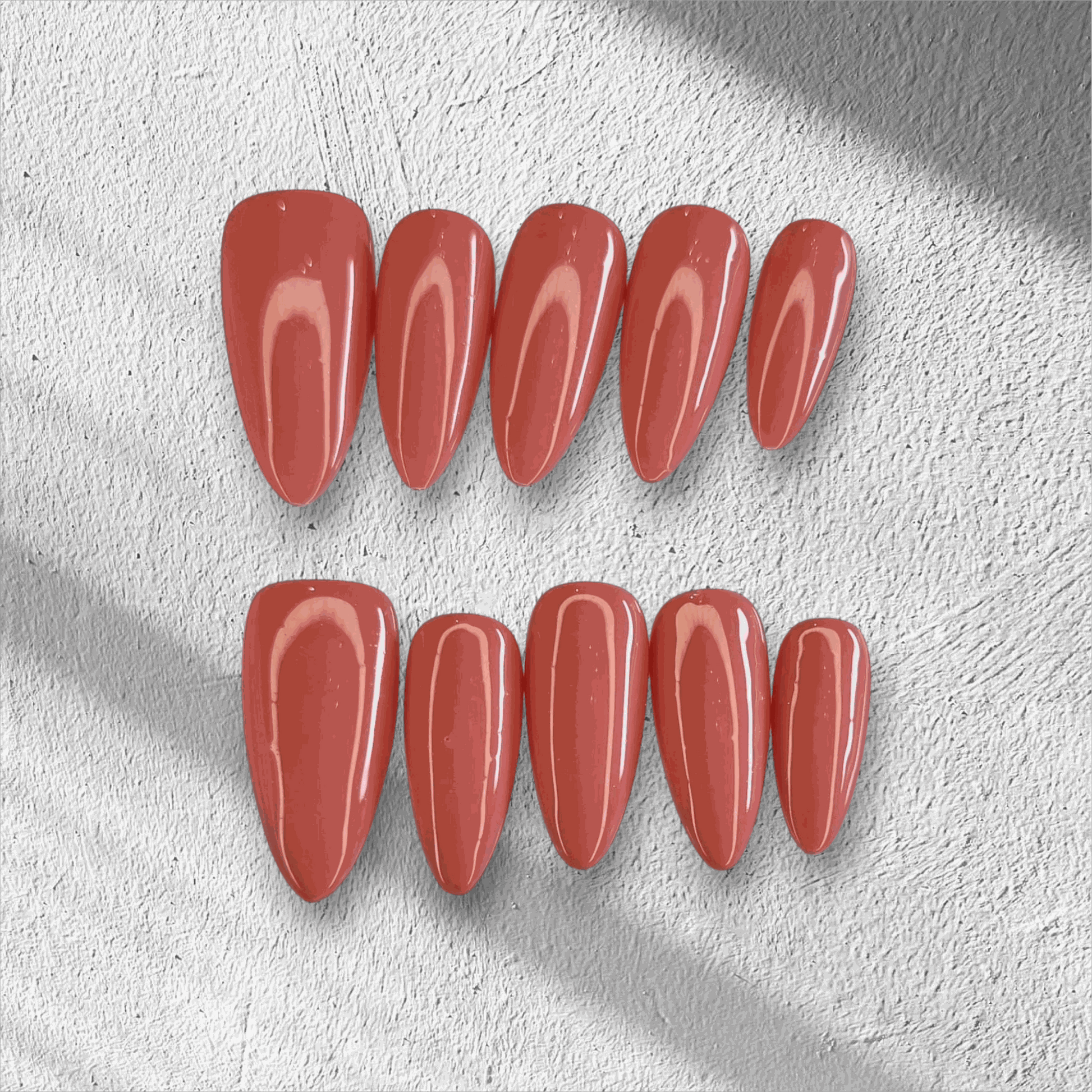 Full set of Rose press-on nails featuring a pink floral design, displayed in the box.