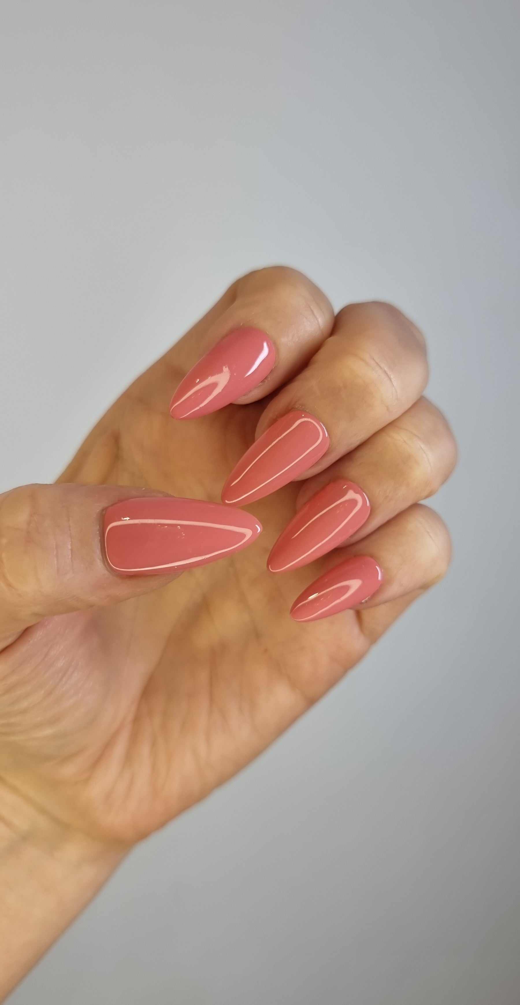 Close-up of the Rose press-on nails with a pink floral pattern.