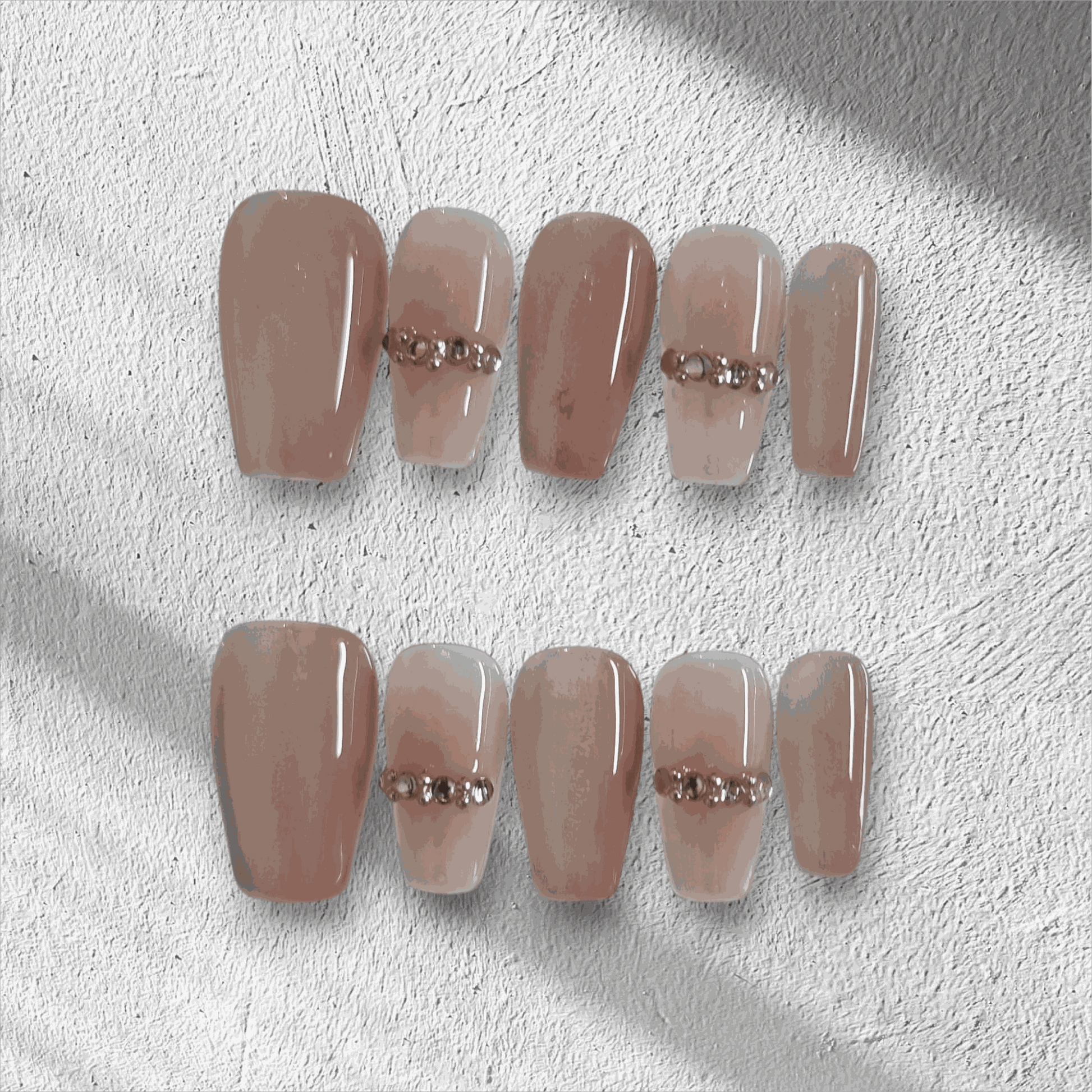 Full set of Sabah cream and white long coffin press-on nails displayed in the box.