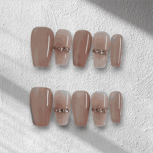 Full set of Sabah cream and white long coffin press-on nails displayed in the box.