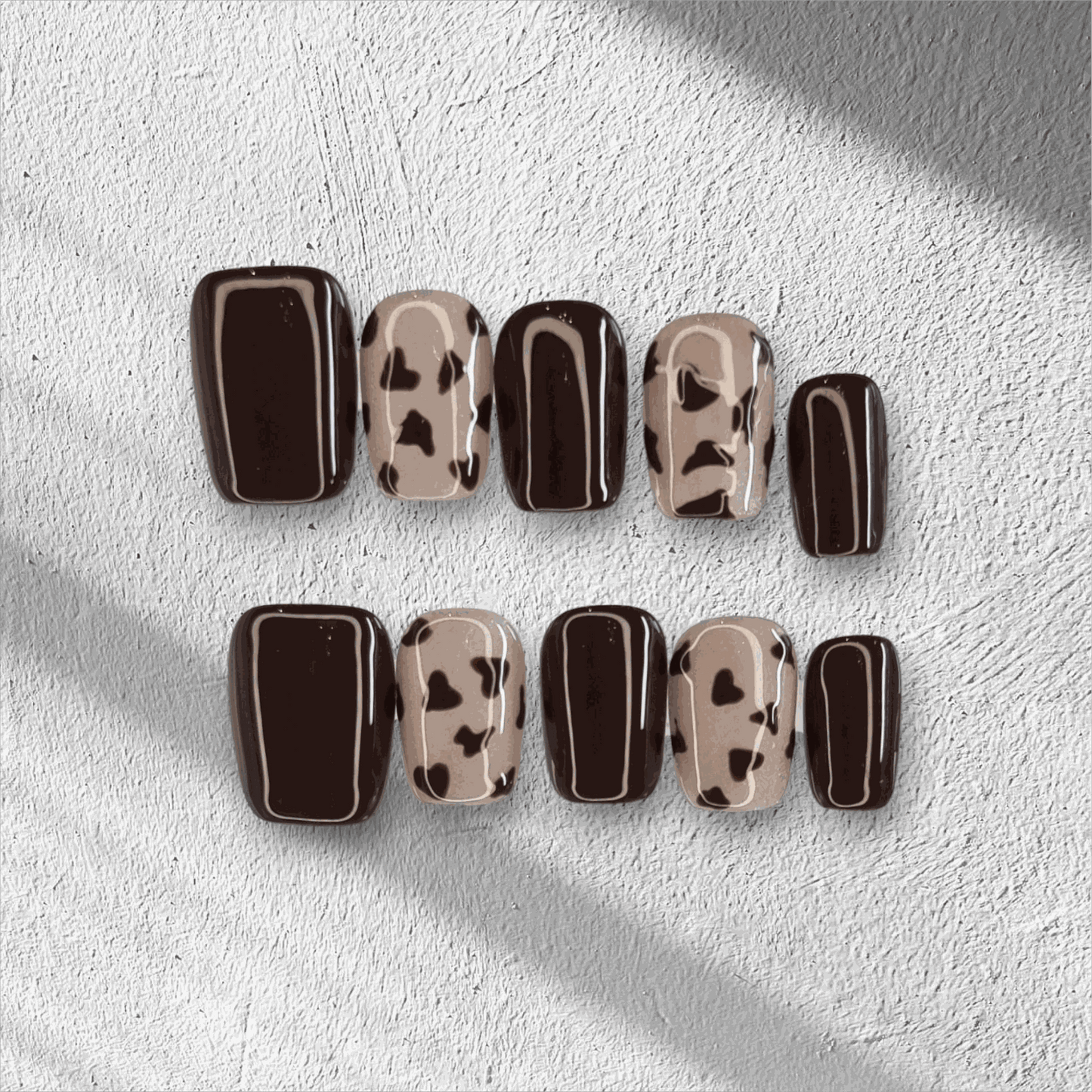 Full set of Samira nude short square press-on nails, displayed in packaging.