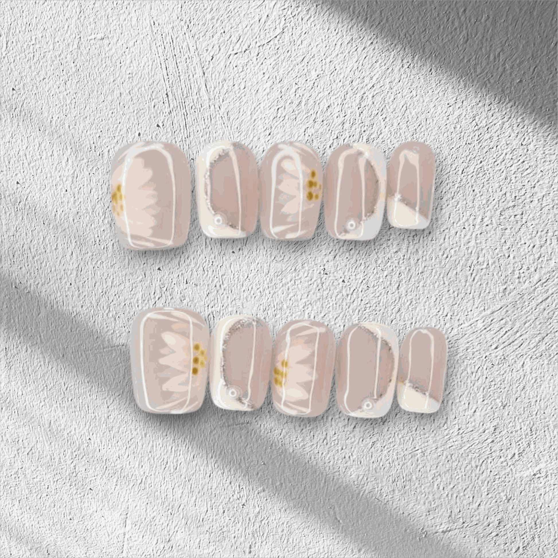 Hand wearing Samira press-on nails, applied professionally by Nail Addict.