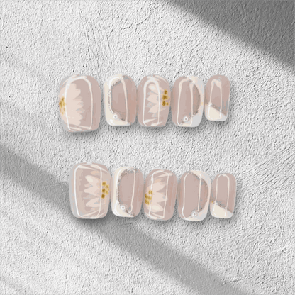 Hand wearing Samira press-on nails, applied professionally by Nail Addict.