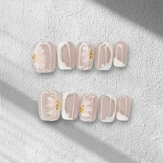 Hand wearing Samira press-on nails, applied professionally by Nail Addict.