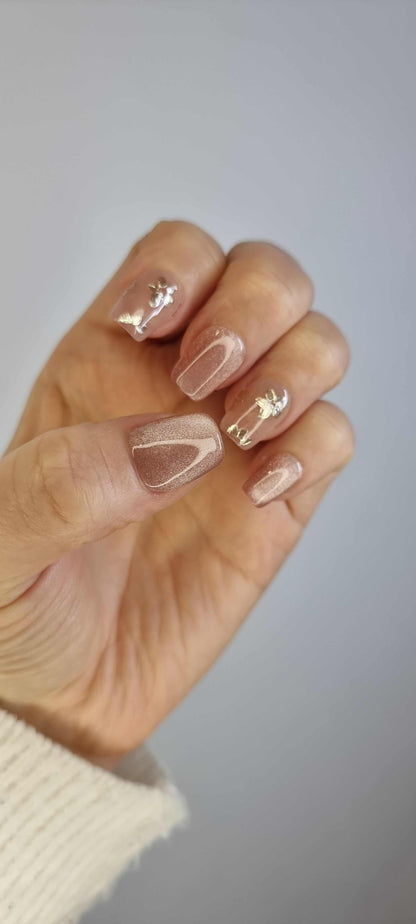 Close-up of Selina nude artificial nails with a high-gloss finish.
