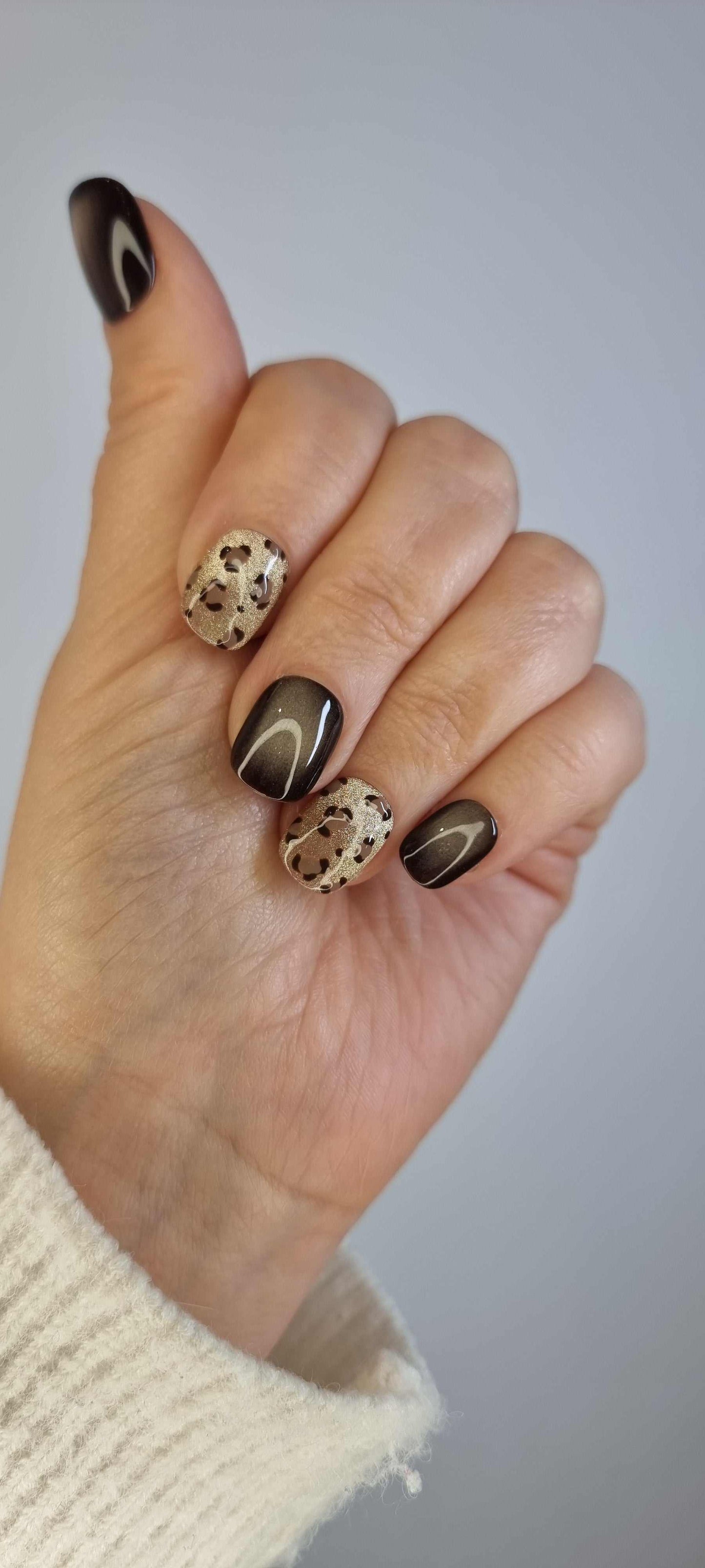 Set of Shaheen false press-on nails with an animal print design.