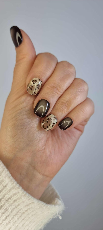 Set of Shaheen false press-on nails with an animal print design.