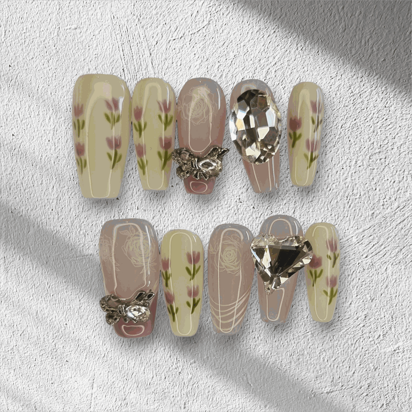 Full set of Sophia light, neutral-toned press-on nails displayed in the box.