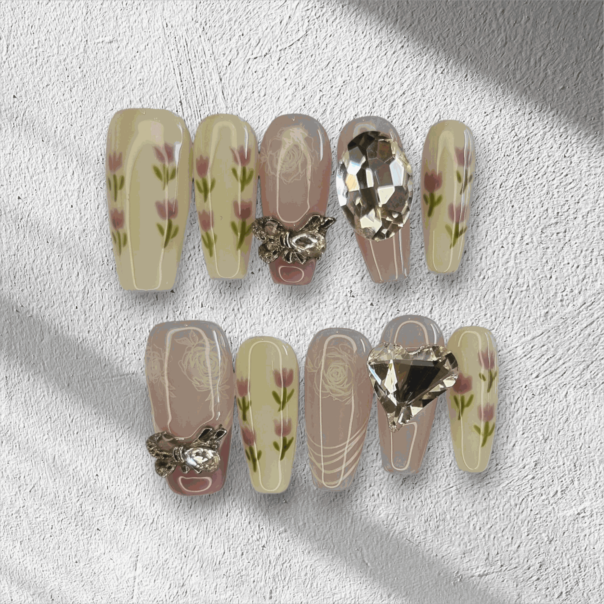 Full set of Sophia light, neutral-toned press-on nails displayed in the box.