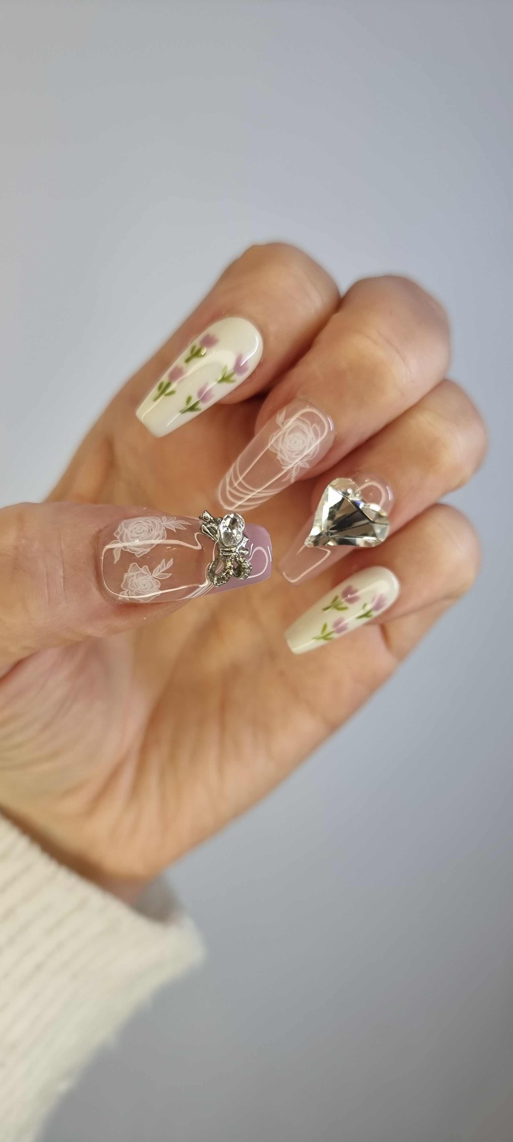 Close-up of Sophia light, neutral-toned press-on nails.