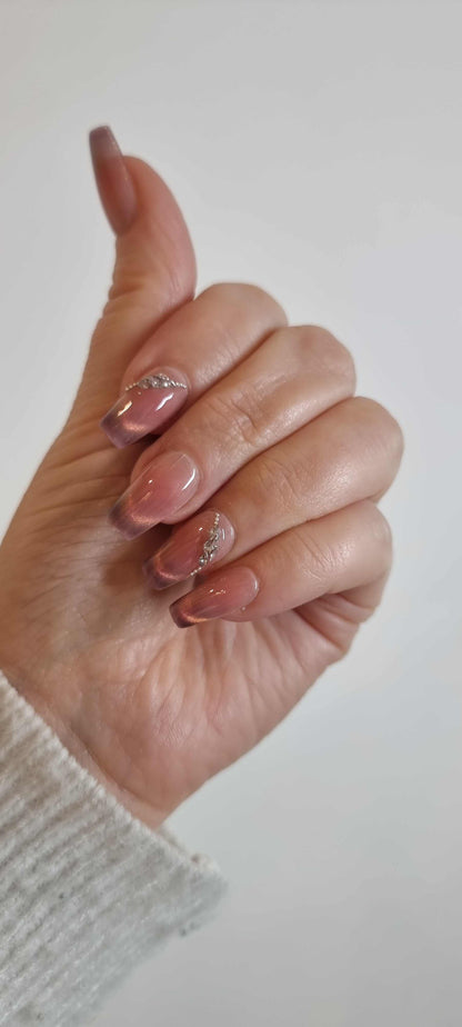 Set of Souq Secrets extra-long, square-shaped press-on nails.