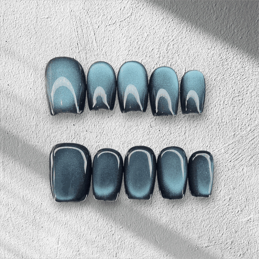 Full set of the Yalla blue magnetic shimmer press-on nails, displayed in the box.