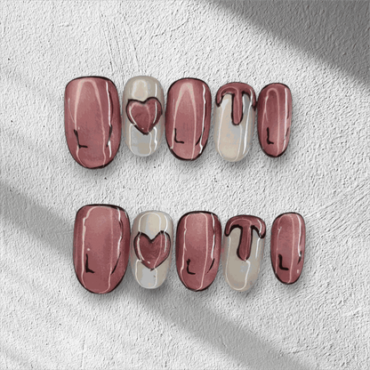 Full set of Zayed Zeal false nails with a unique swirled or marbled design, displayed.