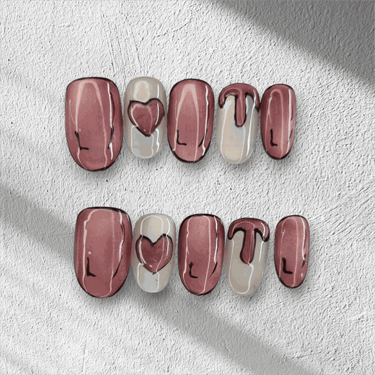 Full set of Zayed Zeal false nails with a unique swirled or marbled design, displayed.